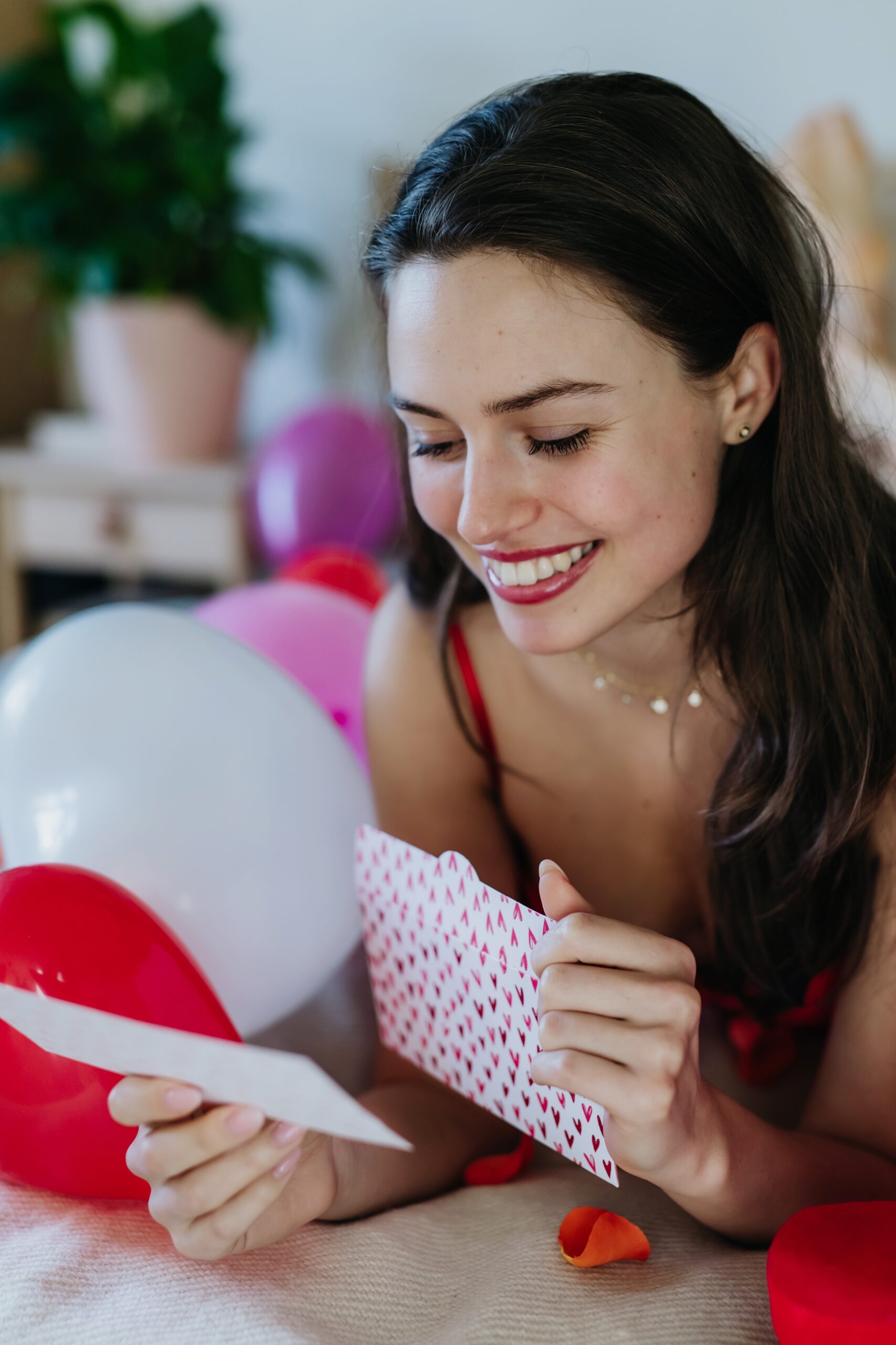 Beautiful,Woman,Lying,On,Bed,And,Reading,Love,Letter,,Gift